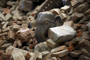 Statue of an elephant is pictured in the debris of a collapsed temple a day after an earthquake in Bhaktapur